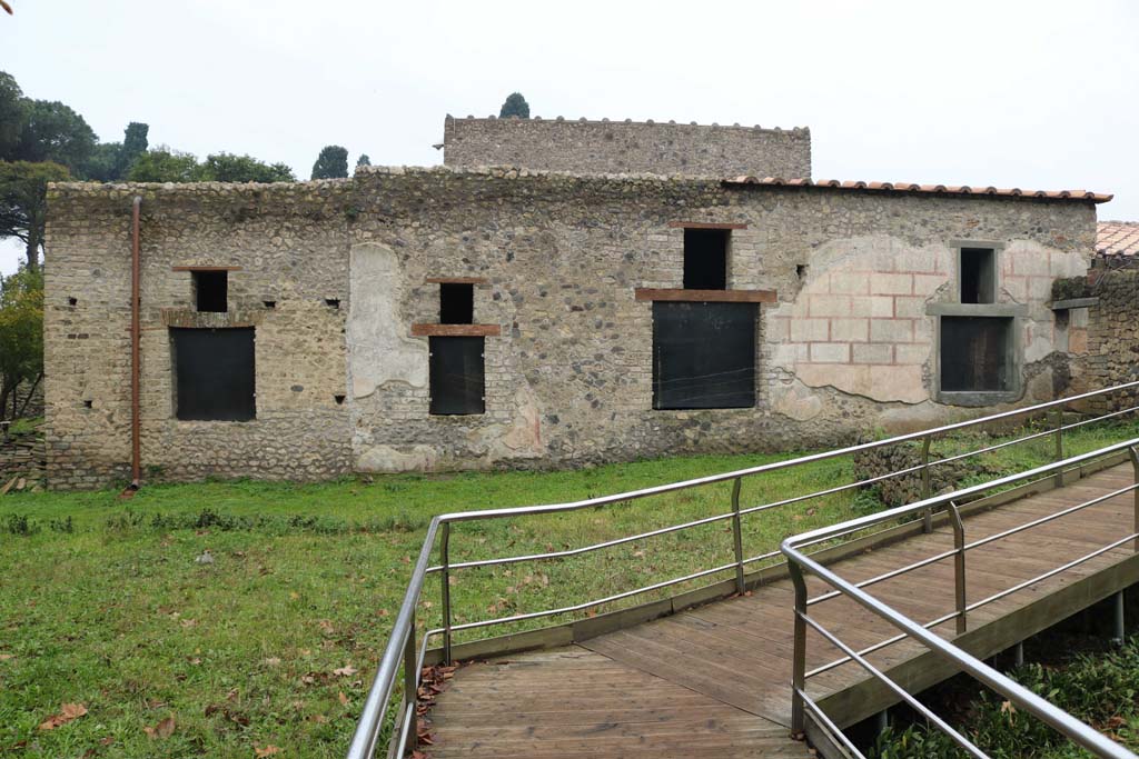 II.4.9 Pompeii. December 2018. 
Looking towards rooms on west side of garden which can be seen at II.4.10. Photo courtesy of Aude Durand.