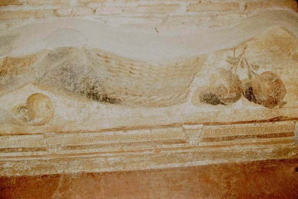 II.4.10 Pompeii. 1957. Atrium, north side, detail of remains of painted plaster with basket and fruits.  Photo by Stanley A. Jashemski.
Source: The Wilhelmina and Stanley A. Jashemski archive in the University of Maryland Library, Special Collections (See collection page) and made available under the Creative Commons Attribution-Non Commercial License v.4. See Licence and use details.
J57f0109