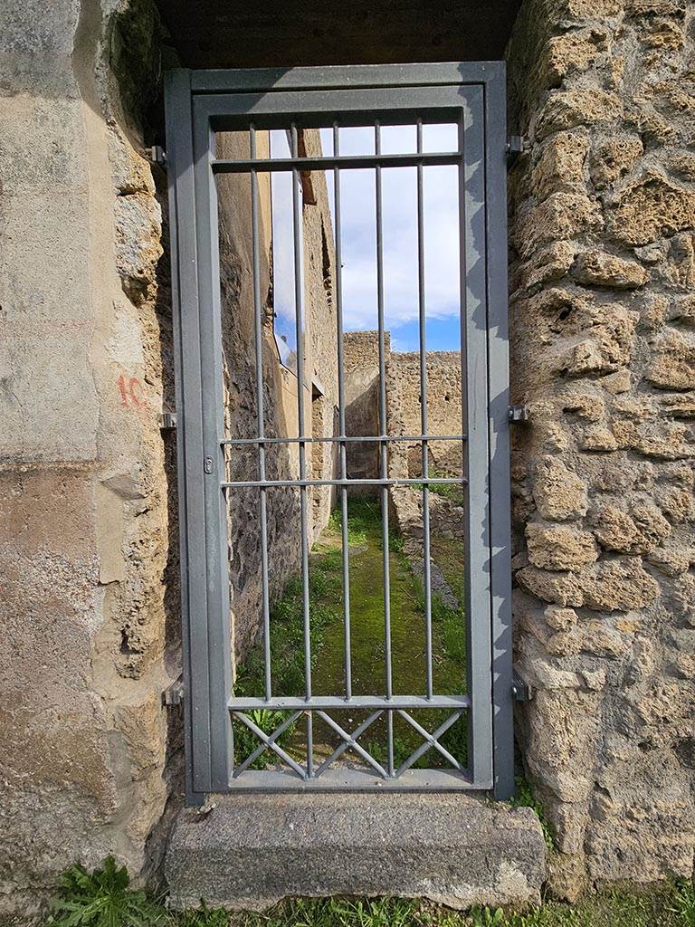 II.4.10 Pompeii. November 2024. 
Looking east towards entrance doorway. Photo courtesy of Annette Haug.