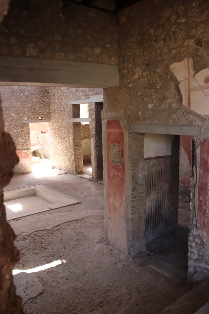 II.4.10 Pompeii. September 2019. Looking towards rooms on west side of atrium. 
Photo courtesy of Klaus Heese.