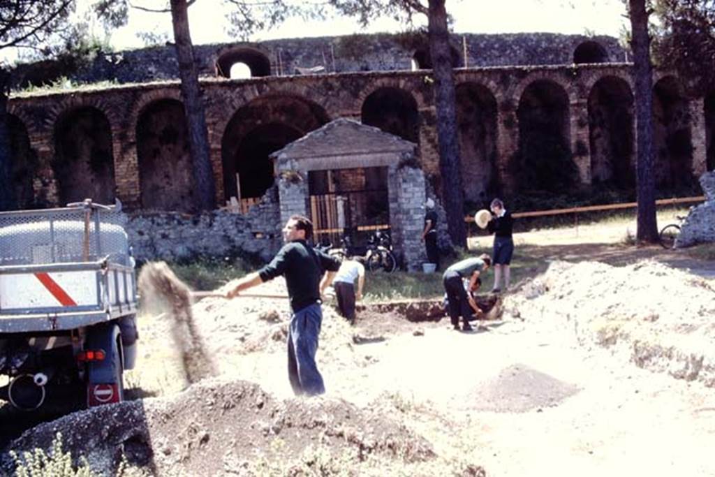 II.5 Pompeii, 1968. Working their way southwards towards the gateway leading to the ampitheatre.  Photo by Stanley A. Jashemski.
Source: The Wilhelmina and Stanley A. Jashemski archive in the University of Maryland Library, Special Collections (See collection page) and made available under the Creative Commons Attribution-Non Commercial License v.4. See Licence and use details.
J68f0108