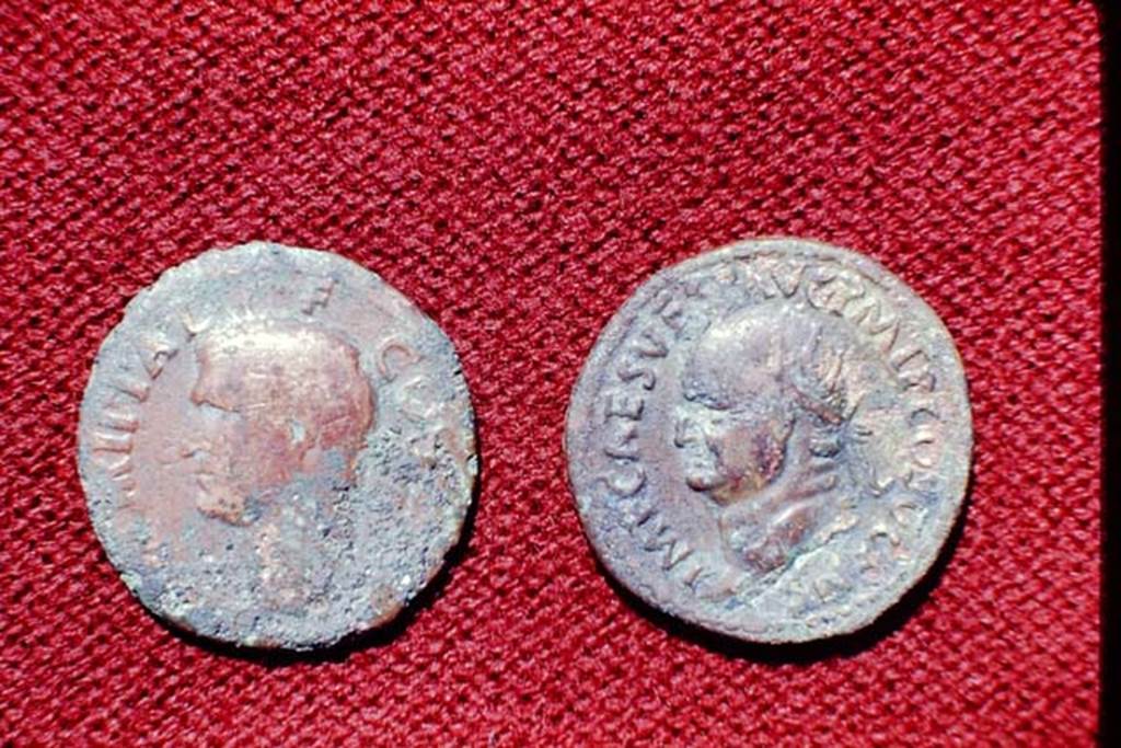II.5 Pompeii, 1968. Detail of coins.  Photo by Stanley A. Jashemski.
Source: The Wilhelmina and Stanley A. Jashemski archive in the University of Maryland Library, Special Collections (See collection page) and made available under the Creative Commons Attribution-Non Commercial License v.4. See Licence and use details.
J68f1781