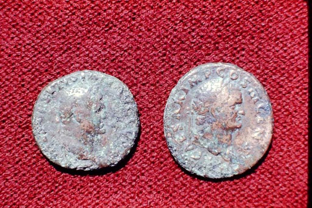 II.5 Pompeii, 1968. Detail of coins.  Photo by Stanley A. Jashemski.
Source: The Wilhelmina and Stanley A. Jashemski archive in the University of Maryland Library, Special Collections (See collection page) and made available under the Creative Commons Attribution-Non Commercial License v.4. See Licence and use details.
J68f1783