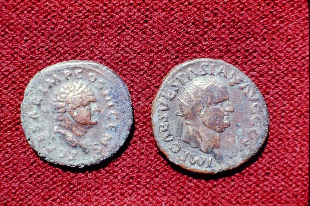 II.5 Pompeii, 1968. Detail of coins.  Photo by Stanley A. Jashemski.
Source: The Wilhelmina and Stanley A. Jashemski archive in the University of Maryland Library, Special Collections (See collection page) and made available under the Creative Commons Attribution-Non Commercial License v.4. See Licence and use details.
J68f1785