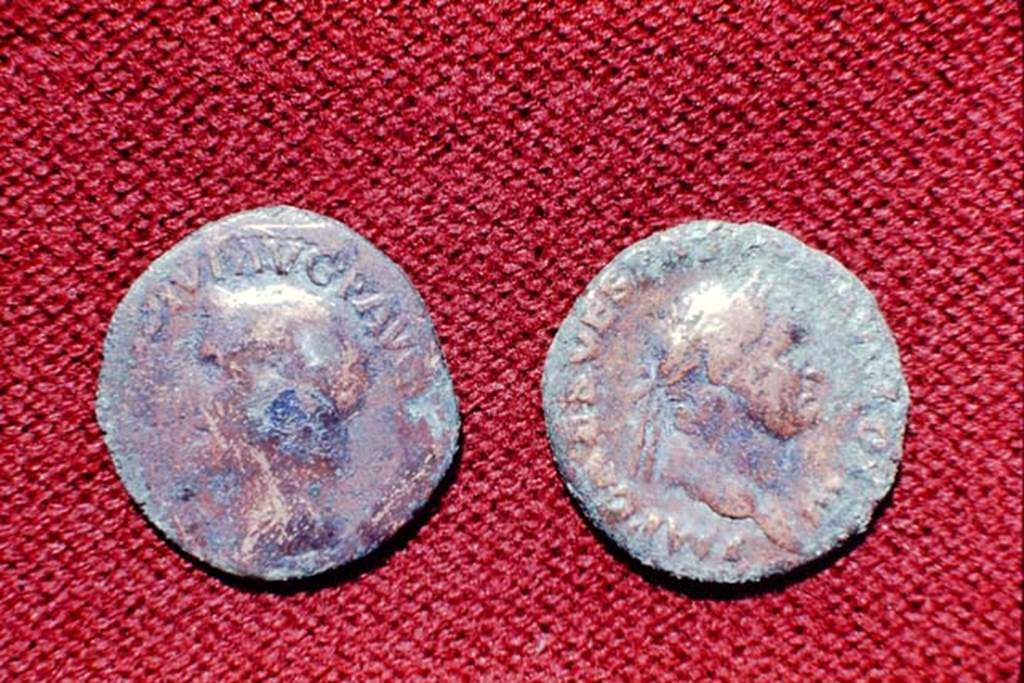 II.5 Pompeii, 1968. Detail of coins.  Photo by Stanley A. Jashemski.
Source: The Wilhelmina and Stanley A. Jashemski archive in the University of Maryland Library, Special Collections (See collection page) and made available under the Creative Commons Attribution-Non Commercial License v.4. See Licence and use details.
J68f1791