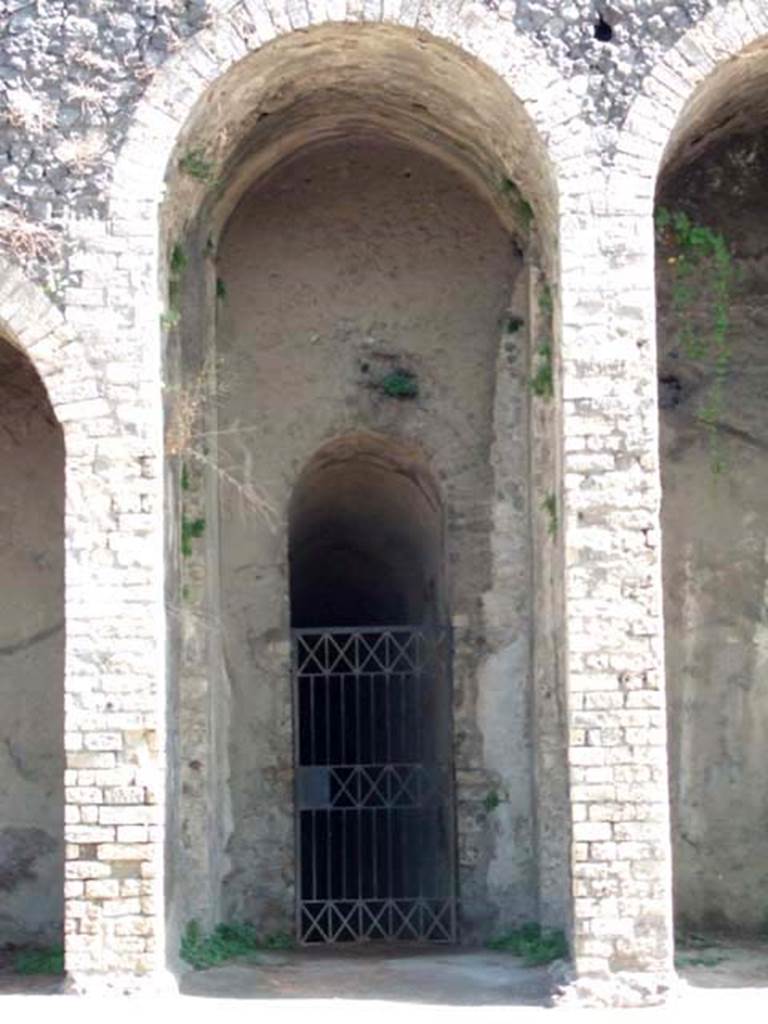 II.6 Pompeii. September 2005. Amphitheatre, entrance doorway under central staircase.
The “death gate” on the west side of the arena, reserved for the bodies of the dead, would lead to this entrance.
See Mau, A., 1907, translated by Kelsey, F. W., Pompeii: Its Life and Art. New York: Macmillan. (p. 215).