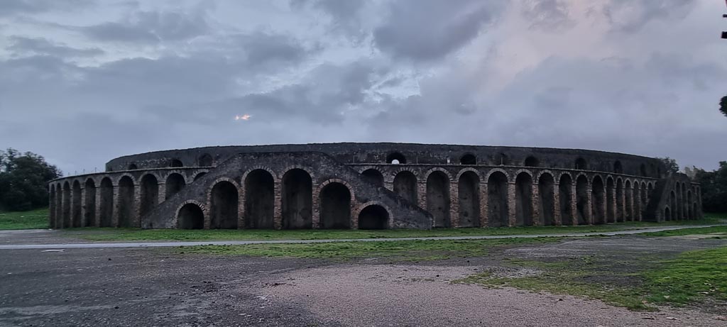 II.6 Pompeii. January 2023. 
Looking towards north end of Amphitheatre, looking south from between II.4 and II.5. Photo courtesy of Miriam Colomer.