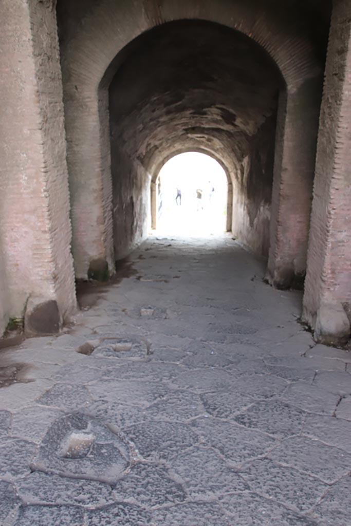 II.6 Pompeii. October 2022. 
Looking south down sloping corridor towards arena. Photo courtesy of Klaus Heese