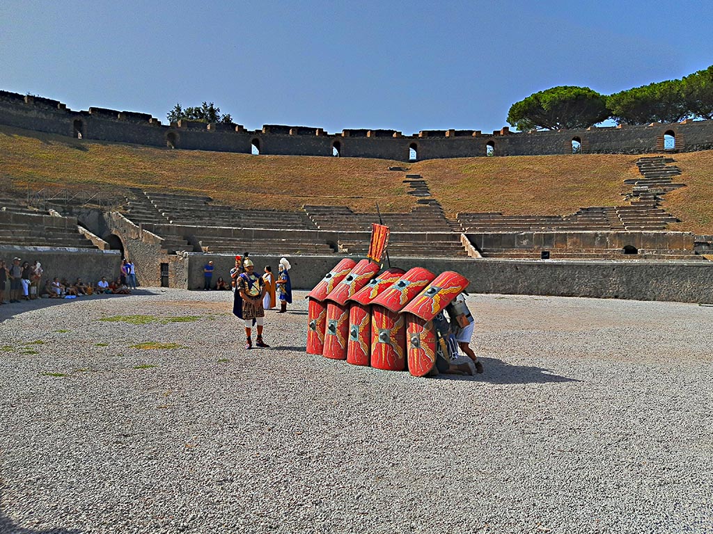 II.6 Pompeii. September 2024. Roman Soldiers – defensive action – forming a side of the Square. 
The hollow square was the formation used to resist/repel cavalry. 
The legionaries would assume a square formation, holding their pila as spears in the space between their shields and strung together shoulder to shoulder. No matter which side the cavalry attacked from, they would be met with a wall of sharp spearheads.
A square formation was also the typical shape of a century in battle.
Photo courtesy of Giuseppe Ciaramella.