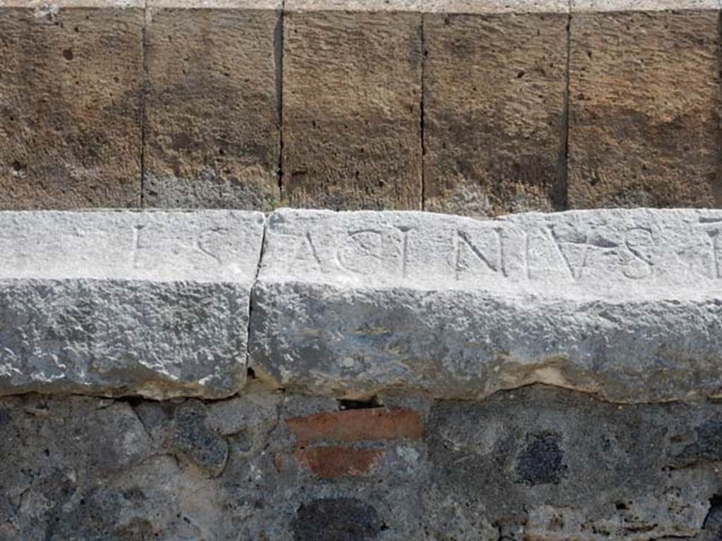 II.6 Pompeii. May 2016. Inscription carved on rim of inner wall of the arena of the Amphitheatre.
Inscription L. SAGINIVS, part of CIL X 855.  Photo courtesy of Buzz Ferebee.