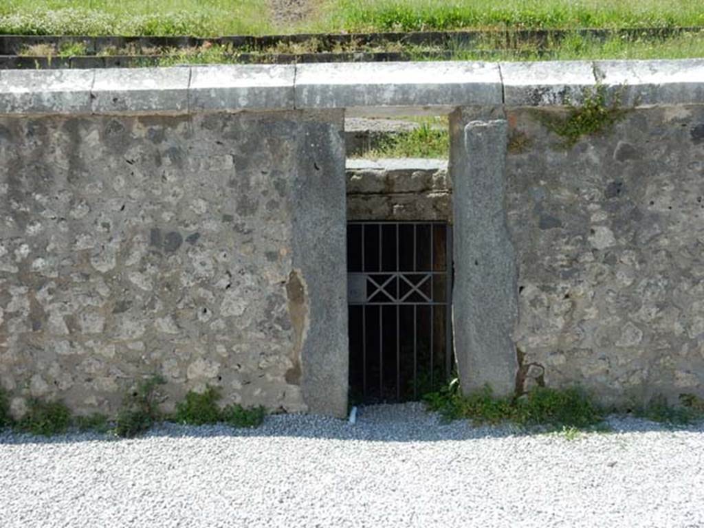 II.6 Pompeii. May 2016. Arena, west side. 
Showing doorway to tunnel leading from arena floor to outside the Amphitheatre.  
According to Mau, this would have been the corridor for removing the bodies of the dead.
Photo courtesy of Buzz Ferebee.