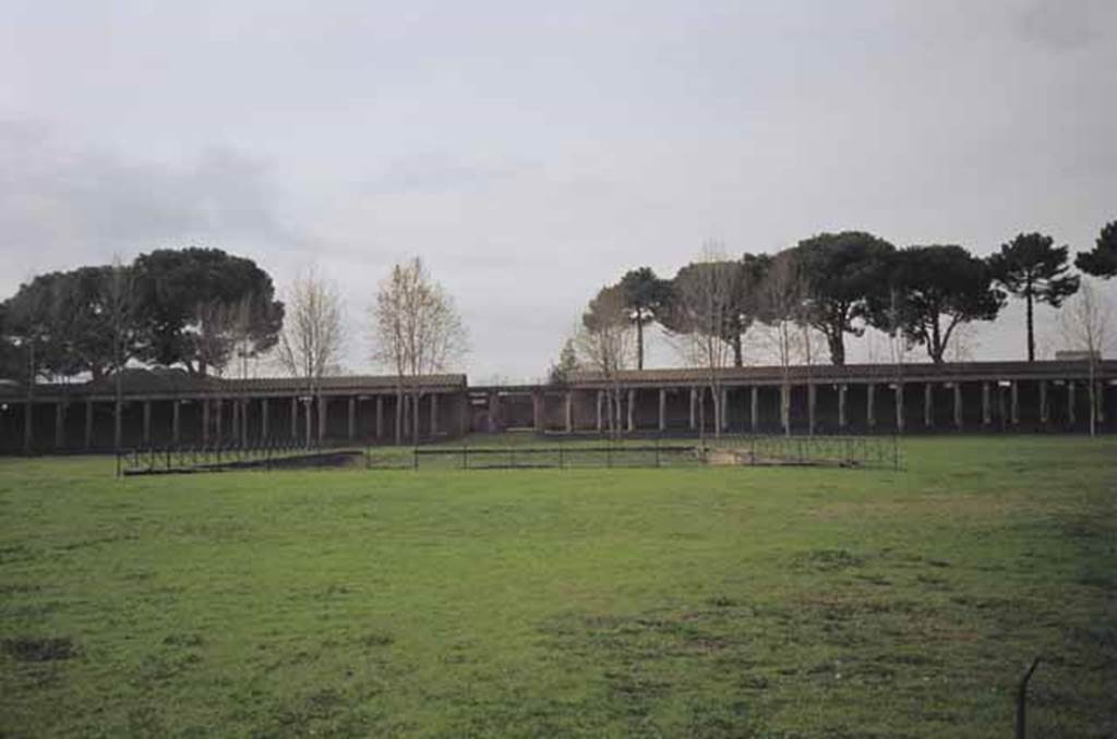 II.7.3 Pompeii. Palaestra. May 2010. View of west side and Piscina or swimming pool, from entrance doorway. 
Photo courtesy of Rick Bauer.
According to NdS 1939; A group of 17 victims were found in an area of about 20 sq metres on the west side of the pool.
Among the more or less isolated people lying there a group of four victims could be identified with the skeleton of a child close to that of another person.
It was not possible to take casts of any of the victims due to the nature of the ash bank not having left any voids.
See Notizie degli Scavi di Antichità, 1939, p. 215.