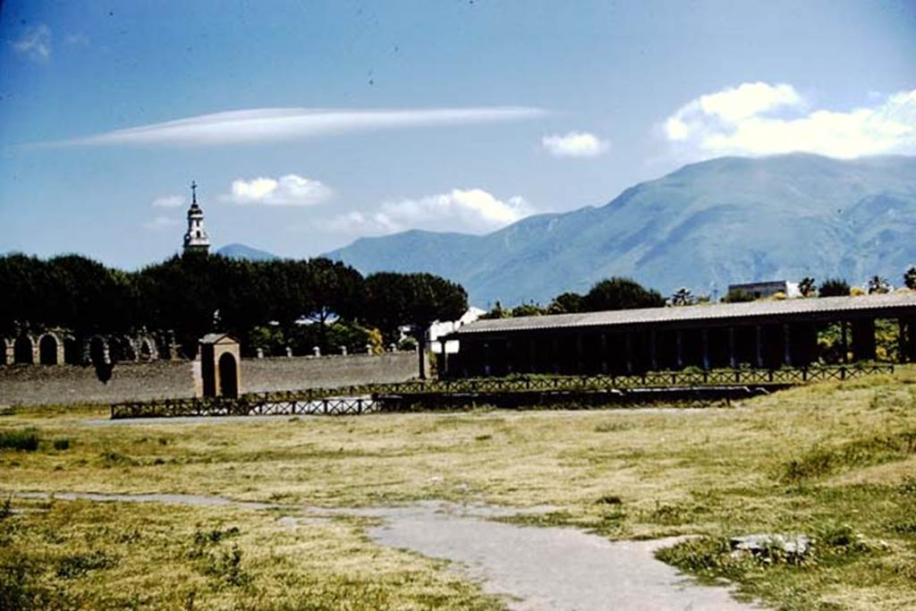 II.7 Pompeii. 1961. Looking south-east across swimming pool in Palaestra.  Photo by Stanley A. Jashemski. Source: The Wilhelmina and Stanley A. Jashemski archive in the University of Maryland Library, Special Collections (See collection page) and made available under the Creative Commons Attribution-Non Commercial License v.4. See Licence and use details.
J61f0289