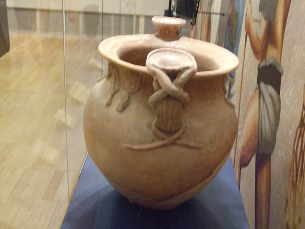 II.8.1 Pompeii. September 2009. Cult Vase, inventory number SAP 10528. Photographed at “A Day in Pompeii” exhibition at Melbourne Museum where it was said to be from “Complesso dei Riti Magici”. However, according to Cicirelli, the vase was found in II.8.1, and not in II.1.12 as put forward by Elia. See Cicirelli, C., Religio: feste e rituali del culto pubblico e privato, in Cibi e Sapori a Pompei e Dintorni, Exhibition Catalogue 2005. (p.35).