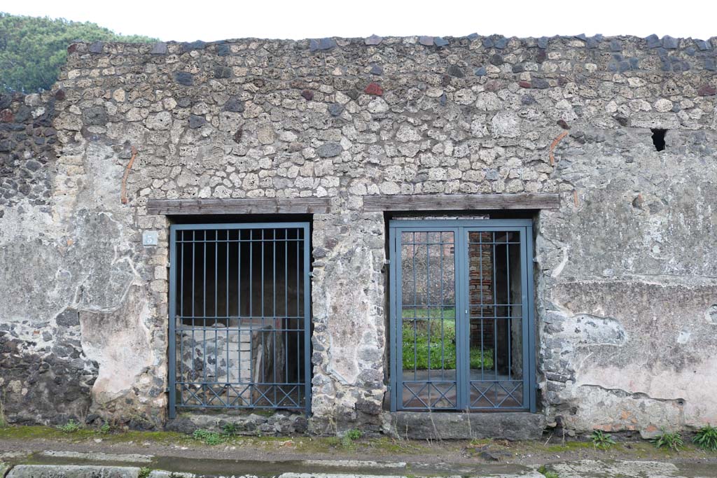 II.8.3 Pompeii, on left. December 2018. 
Looking east on Via di Nocera towards entrance doorways, with II.8.2, on right. Photo courtesy of Aude Durand.