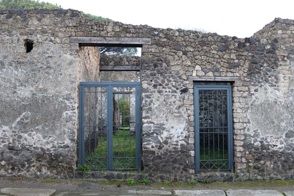 II.8.4 Pompeii, on right. December 2018. 
Looking east on Via di Nocera towards entrance doorways, with II.8.5, on left. Photo courtesy of Aude Durand.
