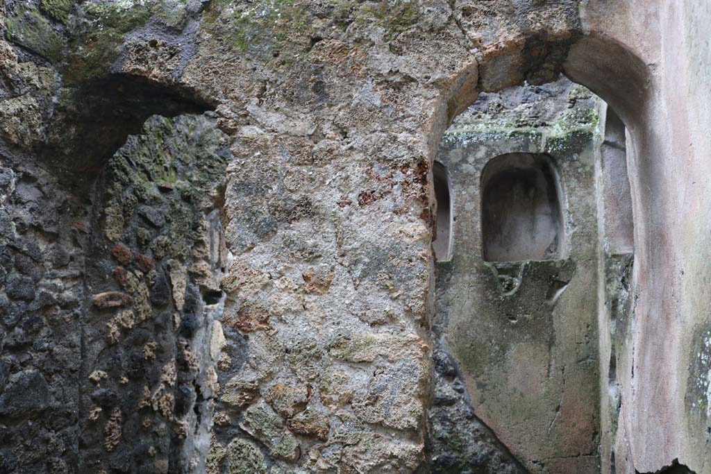 II.8.5 Pompeii. December 2018. Looking south in first room on north side of corridor. 
On the right is a recess/niche containing three other niches. Photo courtesy of Aude Durand.