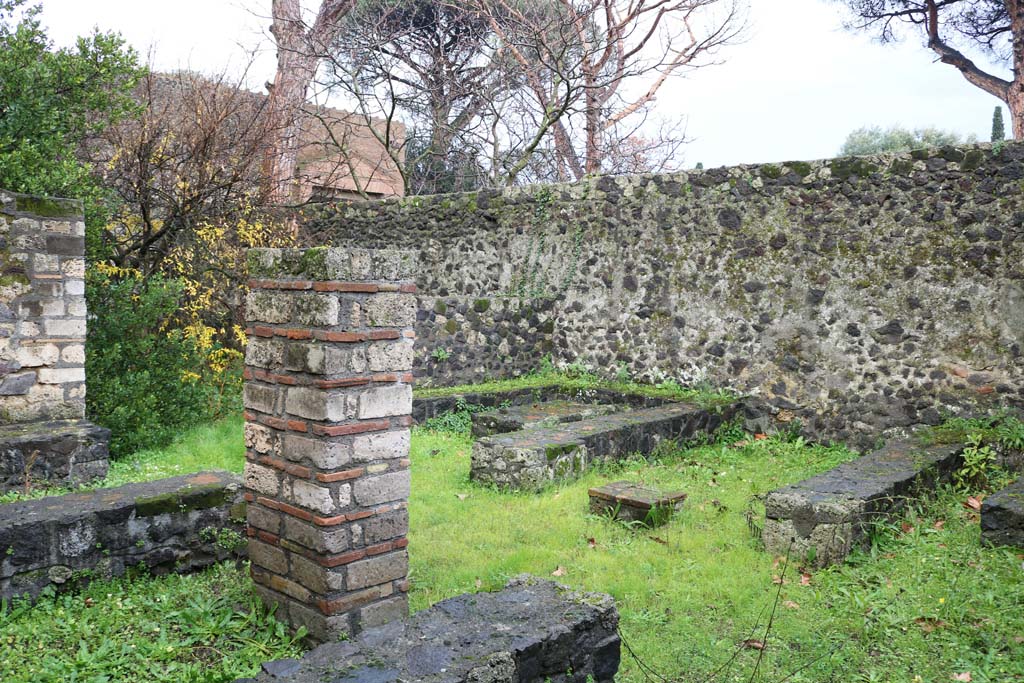 II.8.5 Pompeii. December 2018. 
Looking south-east across three-sided stone benches and tables from the north side towards the south side. Photo courtesy of Aude Durand.