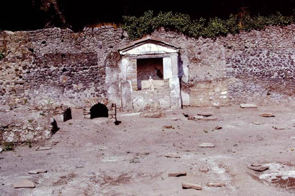 II.8.6 Pompeii, 1973. Looking towards the east wall with statue of Hercules in his lararium or shrine. Photo by Stanley A. Jashemski. 
Source: The Wilhelmina and Stanley A. Jashemski archive in the University of Maryland Library, Special Collections (See collection page) and made available under the Creative Commons Attribution-Non Commercial License v.4. See Licence and use details. J73f0615