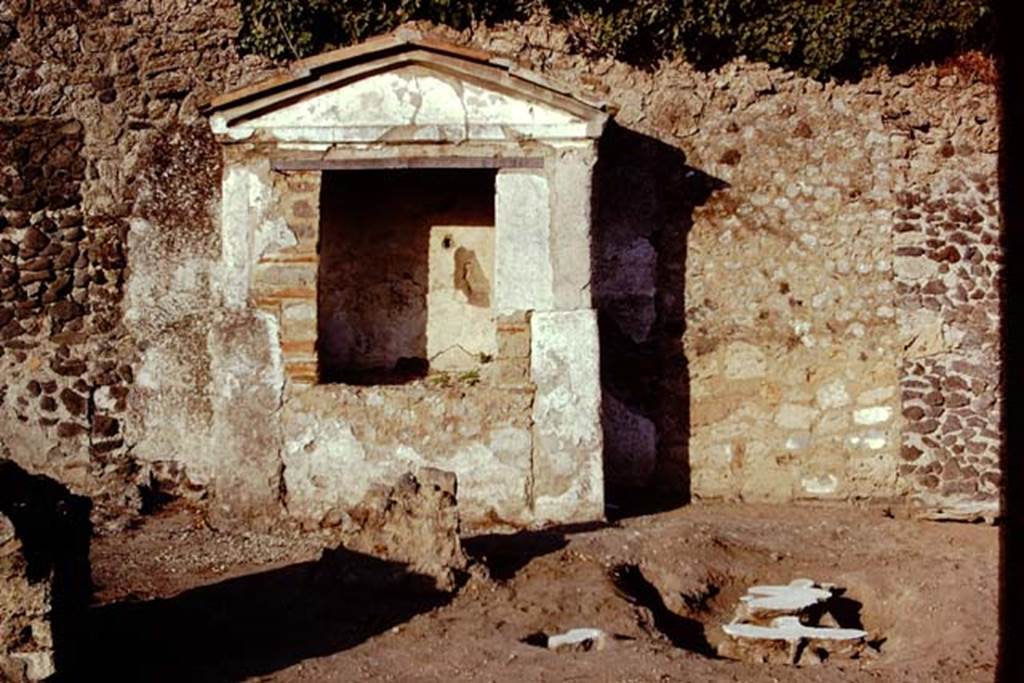 II.8.6 Pompeii. 1974. Altar on east side of garden, with completed filled root casts, which were painted white so the balloon could easily see them from the air. Photo by Stanley A. Jashemski.   
Source: The Wilhelmina and Stanley A. Jashemski archive in the University of Maryland Library, Special Collections (See collection page) and made available under the Creative Commons Attribution-Non Commercial License v.4. See Licence and use details. J74f0688