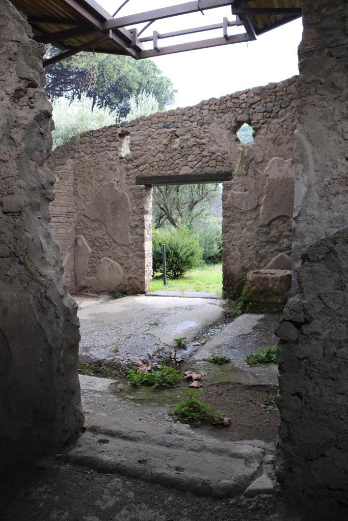 II.8.6 Pompeii. December 2018. 
Looking south through doorway into viridarium. Photo courtesy of Aude Durand.