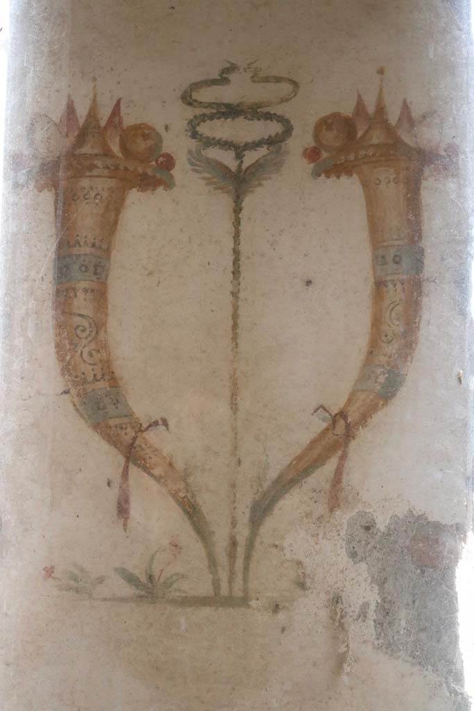 II.9.1 Pompeii. December 2018. 
Detail of Horn of Plenty on north side of column on the north side of the triclinium. Photo courtesy of Aude Durand.