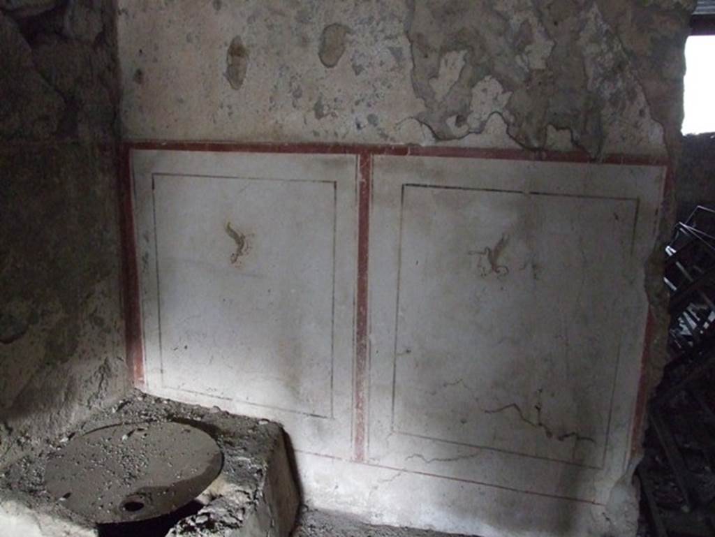 II.9.3 Pompeii. December 2006. Room 11, atrium, north-east corner with paintings of winged creatures.
