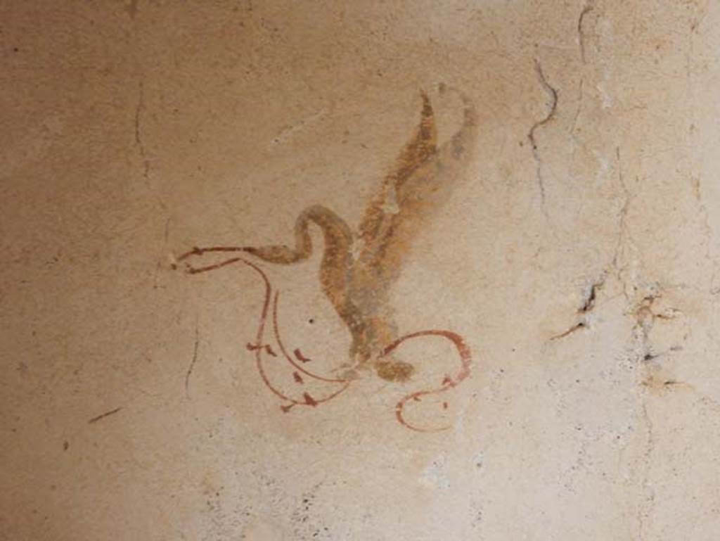 II.9.3, Pompeii. May 2018. Room 11, detail of painted winged creature from east wall in north-east corner. 
Photo courtesy of Buzz Ferebee.