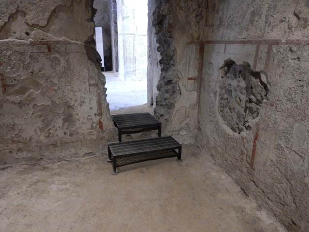 II.9.3, Pompeii. May 2018. Room 10, north-east corner and break in wall linking to atrium 2, of II.9.4
Photo courtesy of Buzz Ferebee.