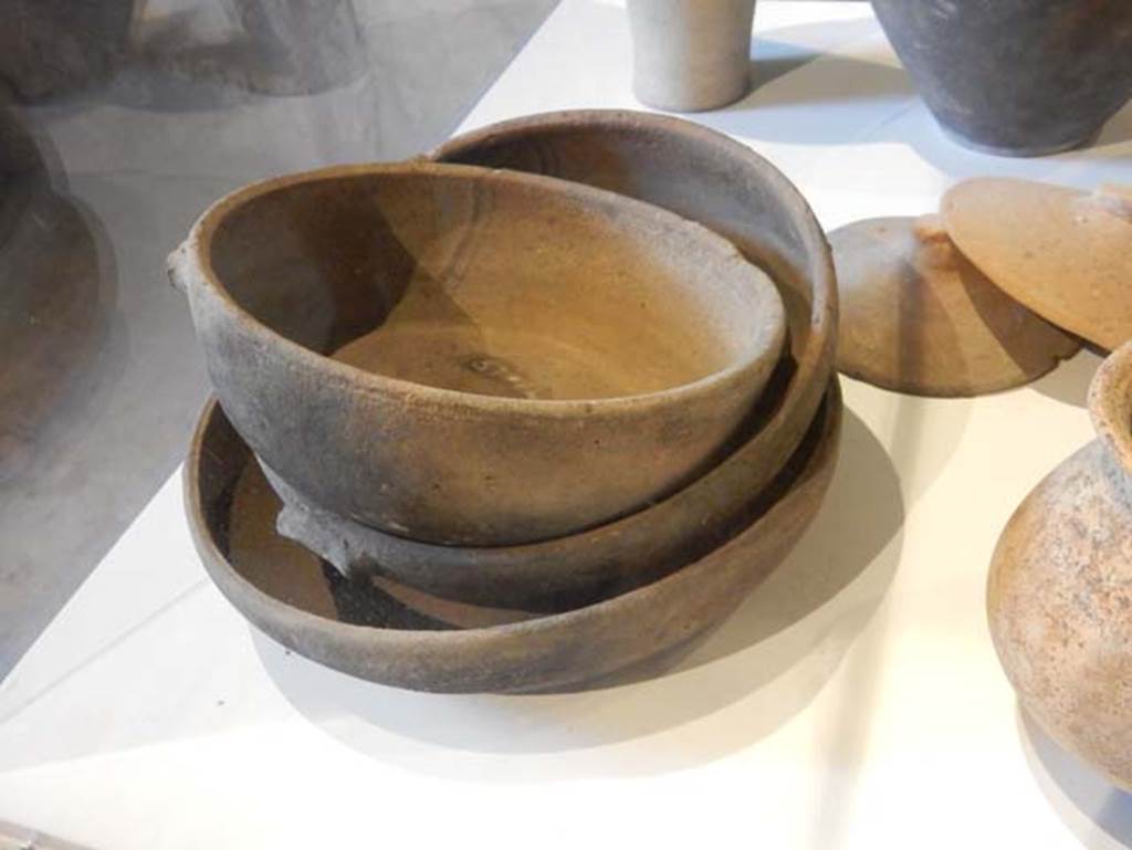 II.9.3, Pompeii. May 2018. Detail of terracotta pans for frying, inv. nos. 37755, 37774, 37426.  Photo courtesy of Buzz Ferebee.