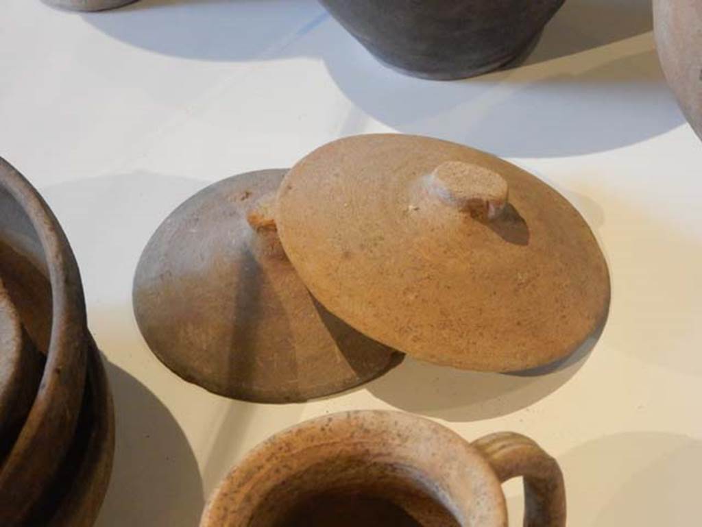 II.9.3, Pompeii. May 2018. Detail of terracotta lids, inv. nos. 37804, 37806. Photo courtesy of Buzz Ferebee.