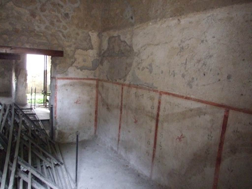 II.9.3 Pompeii. December 2007. Room 14, north-west corner and north wall.
Looking west across atrium to entrance doorway.