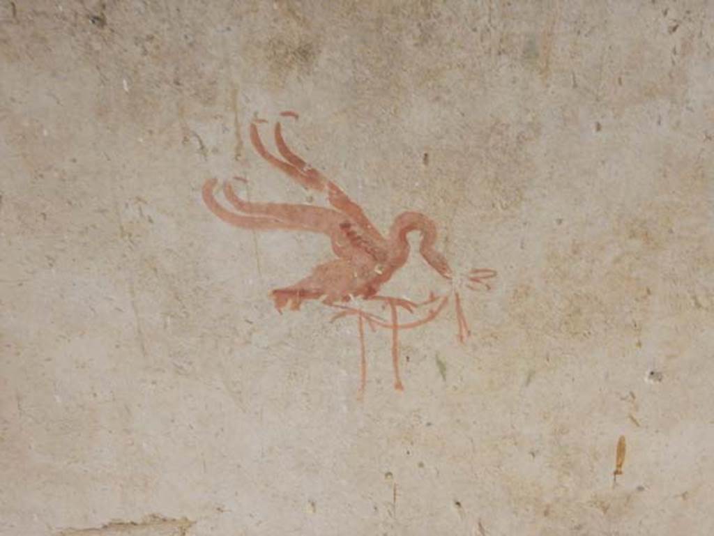 II.9.3, Pompeii. May 2018. Room 14, detail of painted winged creature from north wall.
Photo courtesy of Buzz Ferebee.