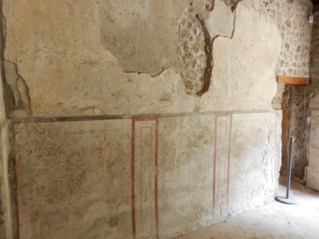 II.9.4, Pompeii. May 2018. Room 5, north wall, with doorway to room 6, on right.
Photo courtesy of Buzz Ferebee.
