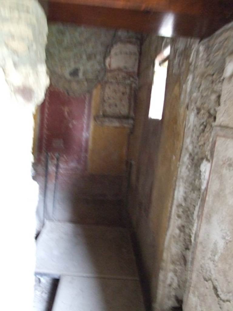 II.9.4 Pompeii. December 2007. Doorway to room 6, cubiculum with floral lararium.