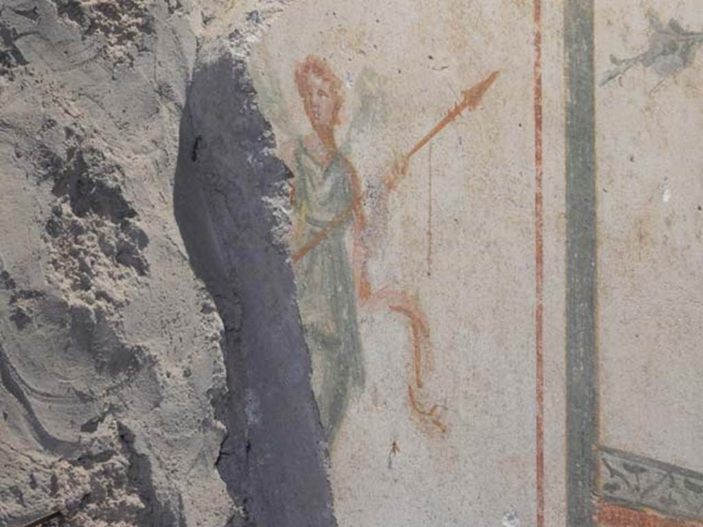 II.9.4, Pompeii. May 2018. Room 6, detail of painted figure from above doorway in south wall.
Photo courtesy of Buzz Ferebee.