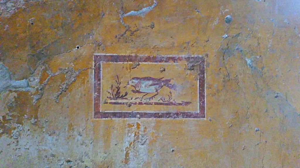II.9.4 Pompeii. 2018. 
Room 8, painted panel with bird in centre of panel at north end of east wall. Photo courtesy of Giuseppe Ciaramella.