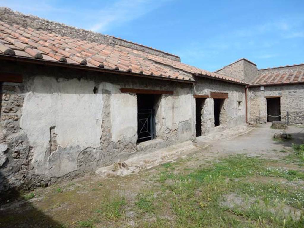 II.9.4, Pompeii. May 2018. Looking north along west garden/house wall towards kitchen doorway, room 7. 
Photo courtesy of Buzz Ferebee.