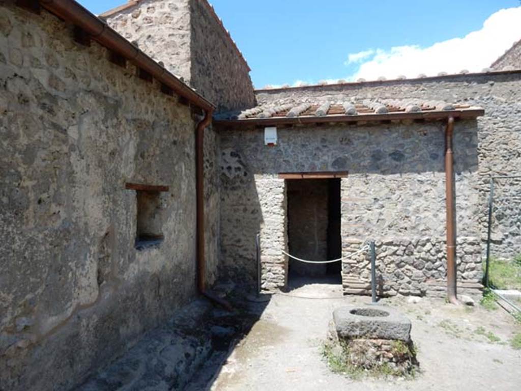 II.9.4, Pompeii. May 2018. Looking towards north wall of garden area with doorway to room 7, kitchen.
Photo courtesy of Buzz Ferebee.