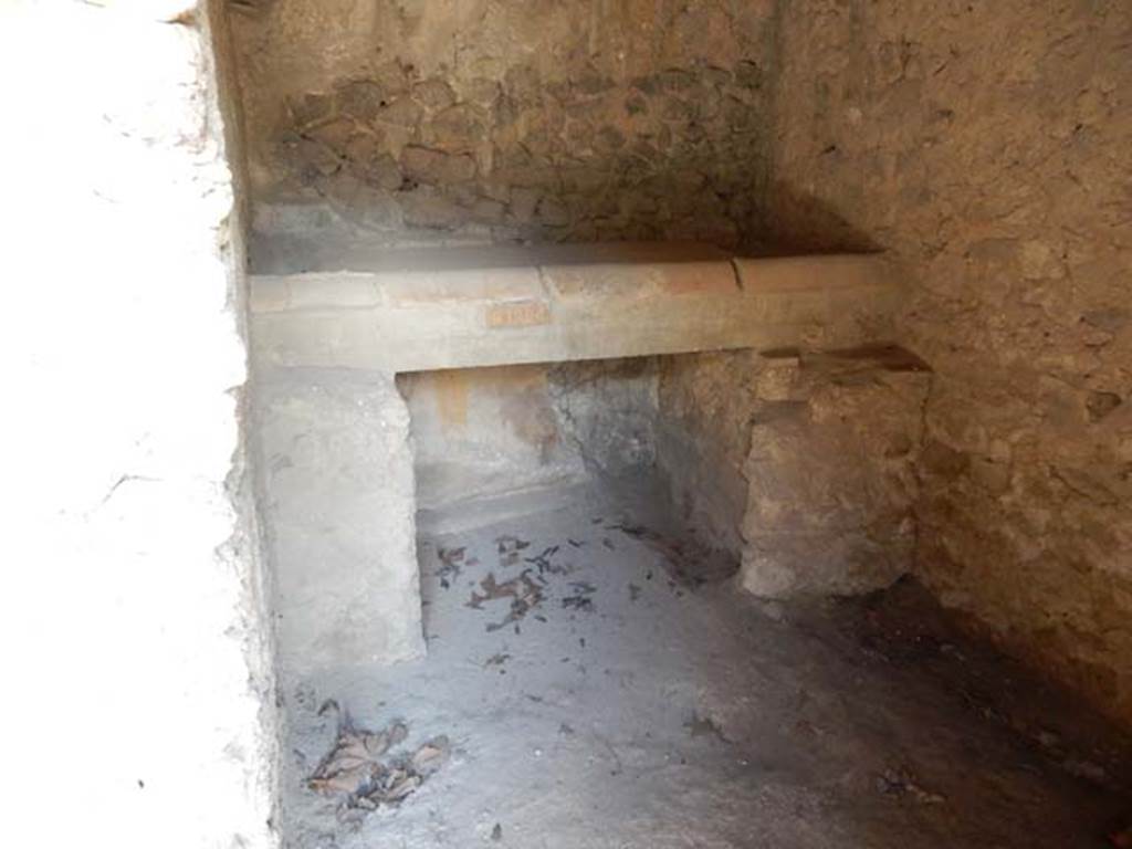 II.9.4, Pompeii. May 2018. Room 7, looking north in kitchen towards hearth/bench. Photo courtesy of Buzz Ferebee.