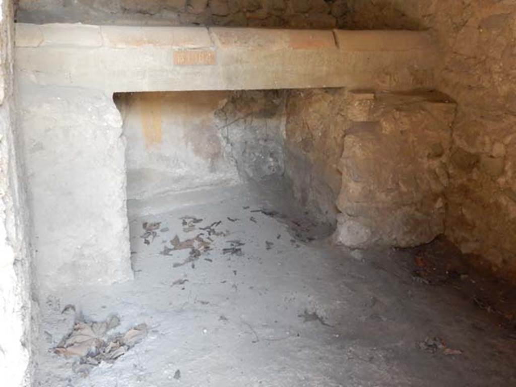 II.9.4, Pompeii. May 2018. Room 7, kitchen bench/hearth against north wall. Photo courtesy of Buzz Ferebee.