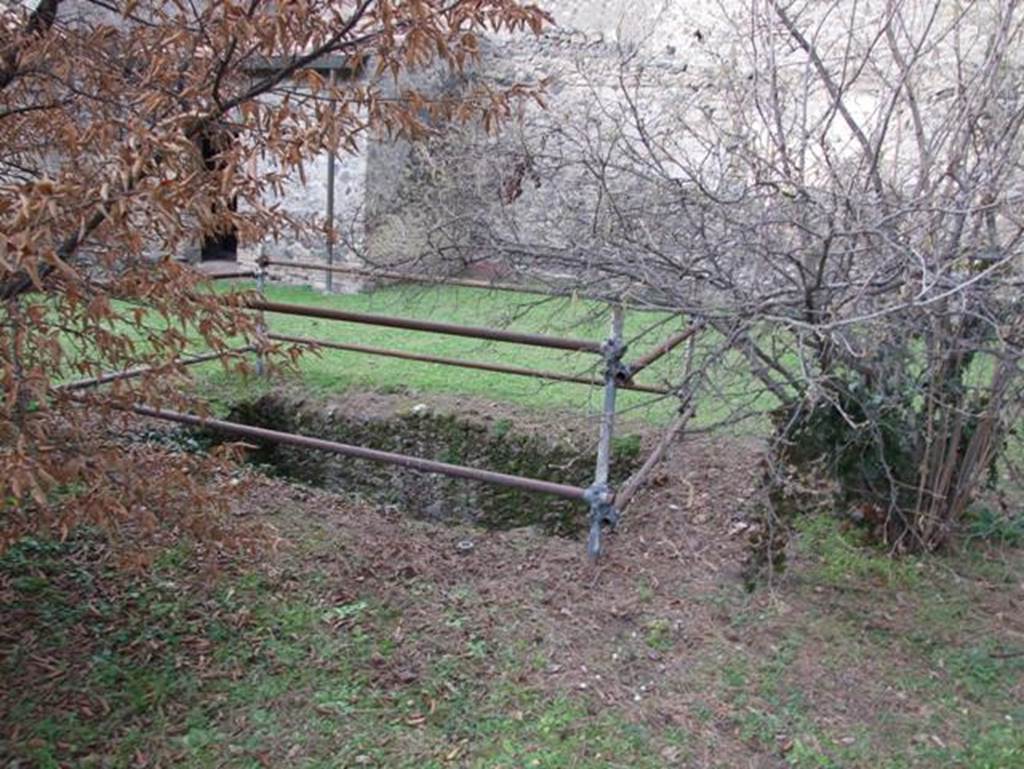 II.9.4 Pompeii. December 2007. Pool in garden area, looking north-west towards kitchen outbuilding.