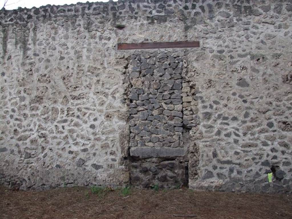 II.9.4 Pompeii. December 2006. Door blocked in antiquity in rear wall taken from vicolo on east side next to Palaestra.