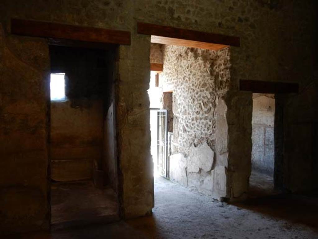II.9.4, Pompeii. May 2018. 
Looking west across atrium 2, with doorway to room 3, on left, entrance corridor, centre, and room 1, on right.
Photo courtesy of Buzz Ferebee.