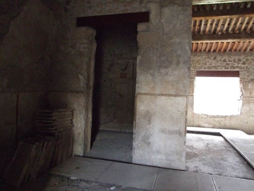 II.9.4 Pompeii. December 2007. Looking across room 2 atrium, towards doorway to room 4 in north-east corner of atrium.
Room 5, is on the right.