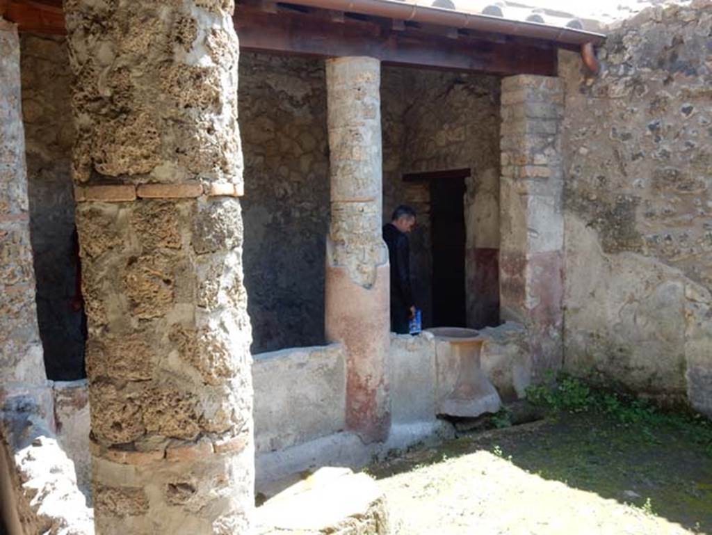 II.9.5 Pompeii, May 2018. 
Peristyle 6, looking from east portico towards south portico in south-west corner and doorway to entrance corridor. Photo courtesy of Buzz Ferebee.