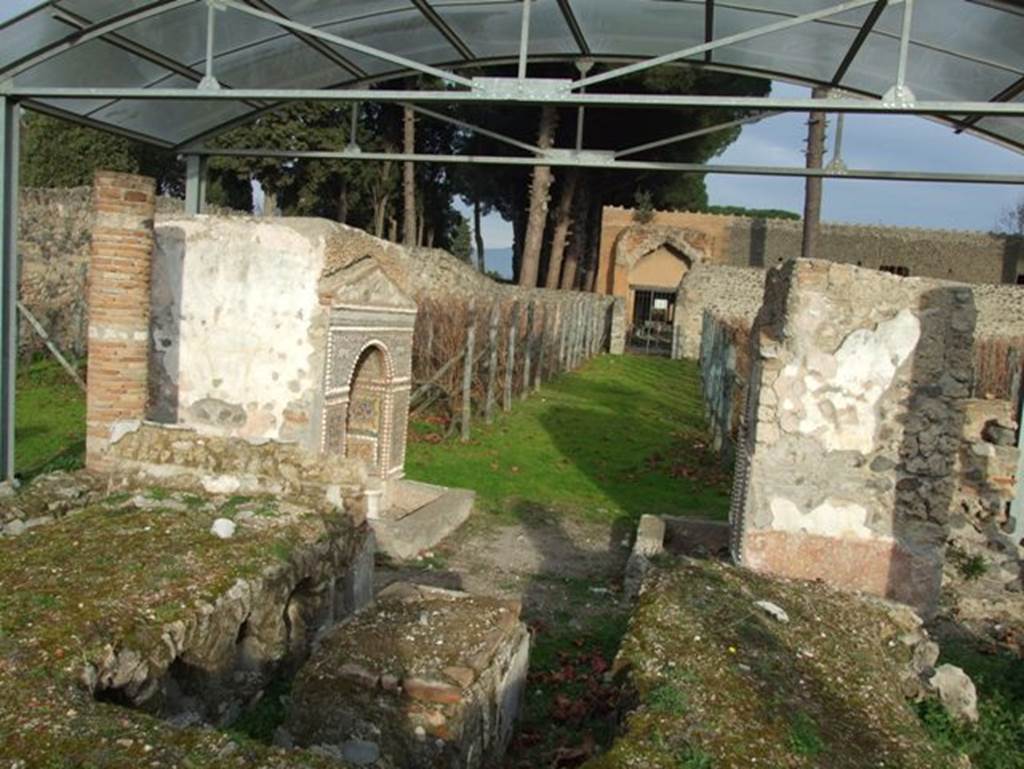 II.9.7. Garden entrance to House of Summer Triclinium.  December 2007.  Triclinium on west of two fountains.