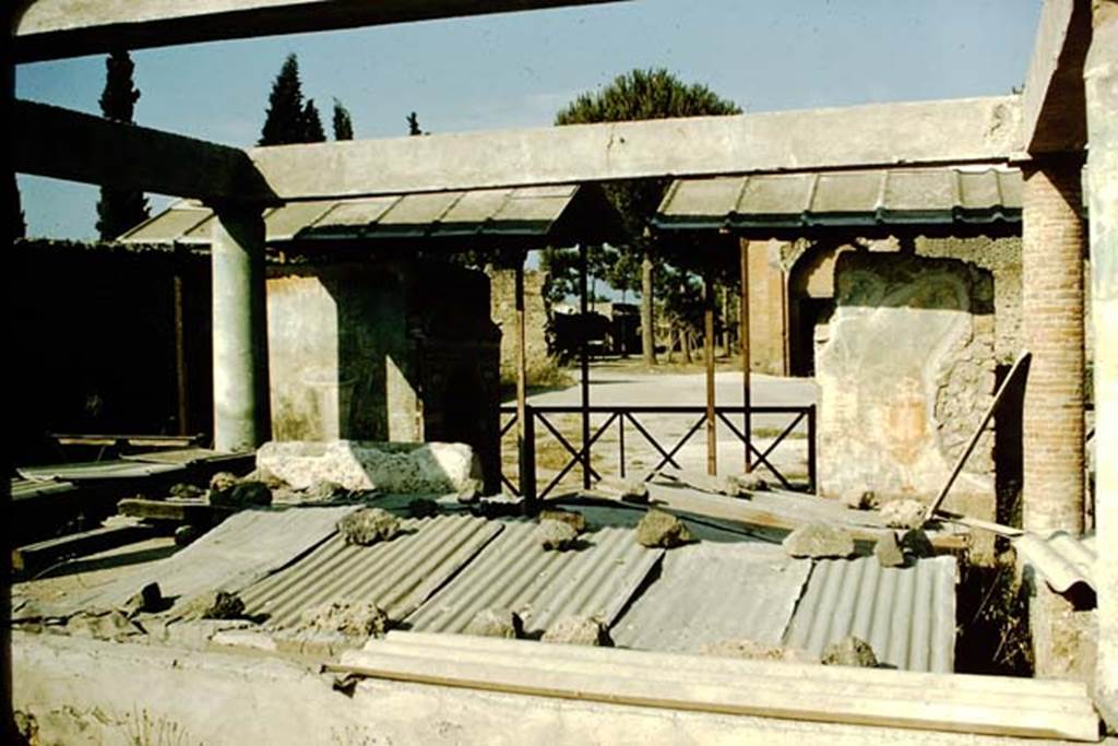 II.9.7 Pompeii. 1957.  Triclinium on west side of two fountains, looking east towards one of the doorways into the Palestra. Photo by Stanley A. Jashemski.
Source: The Wilhelmina and Stanley A. Jashemski archive in the University of Maryland Library, Special Collections (See collection page) and made available under the Creative Commons Attribution-Non Commercial License v.4. See Licence and use details.
J57f0355
