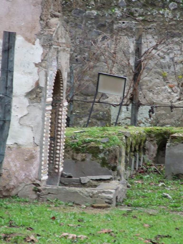 II.9.7 Garden entrance to House of Summer Triclinium.  December 2006.
East wall of south mosaic fountain.