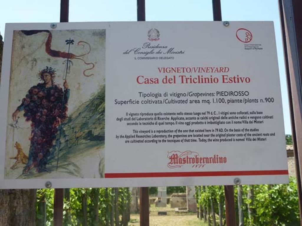 11.9.7 Pompeii. June 2012. Notice on doorway describing the reproduction vineyard, and its grapes and wine. Photo courtesy of Michael Binns.